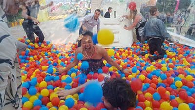 people playing at the ball pit